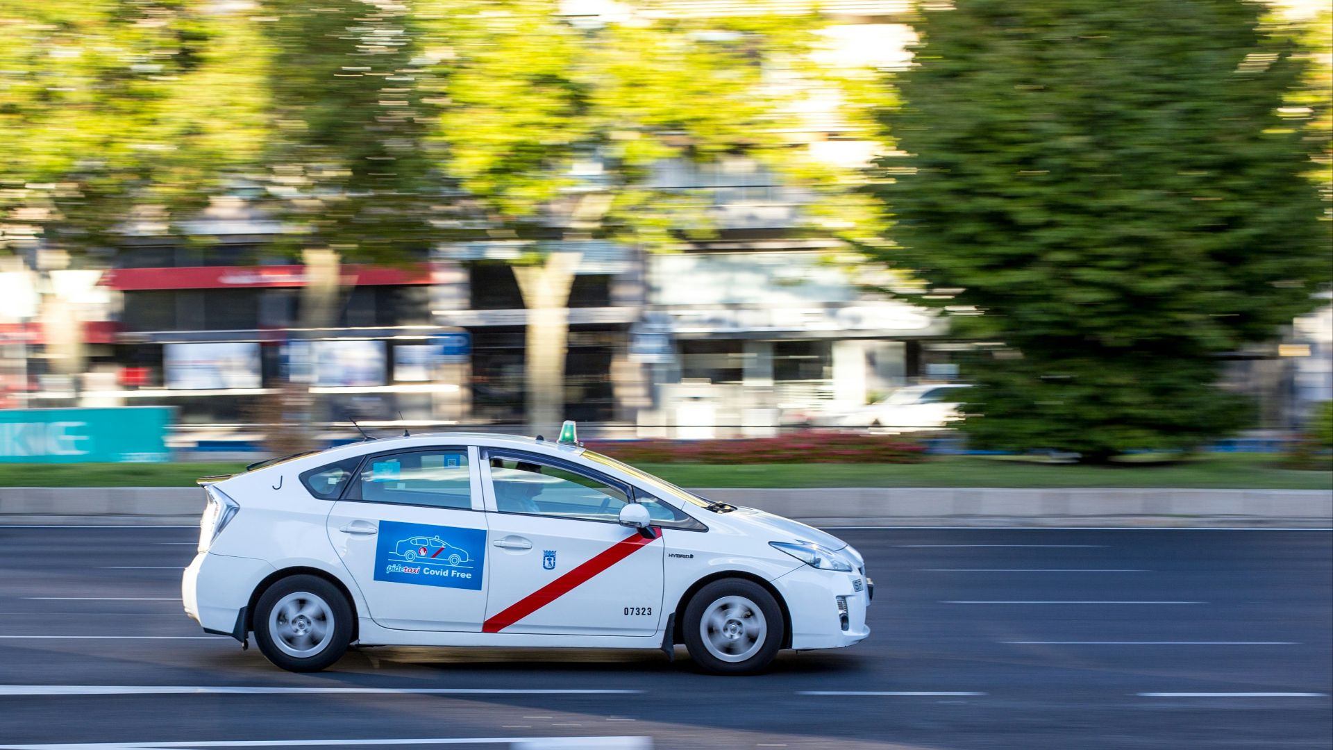 white sedan on road during daytime
