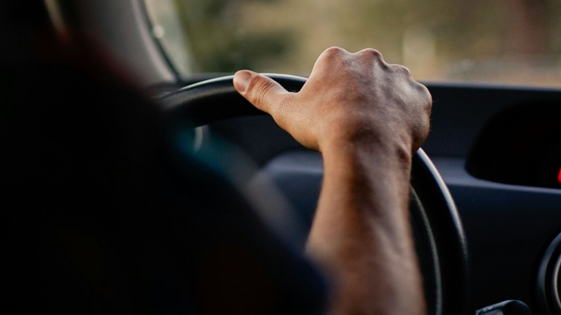 person driving car during daytime