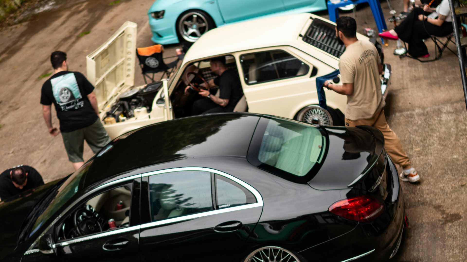 Several cars parked in a row outdoors.