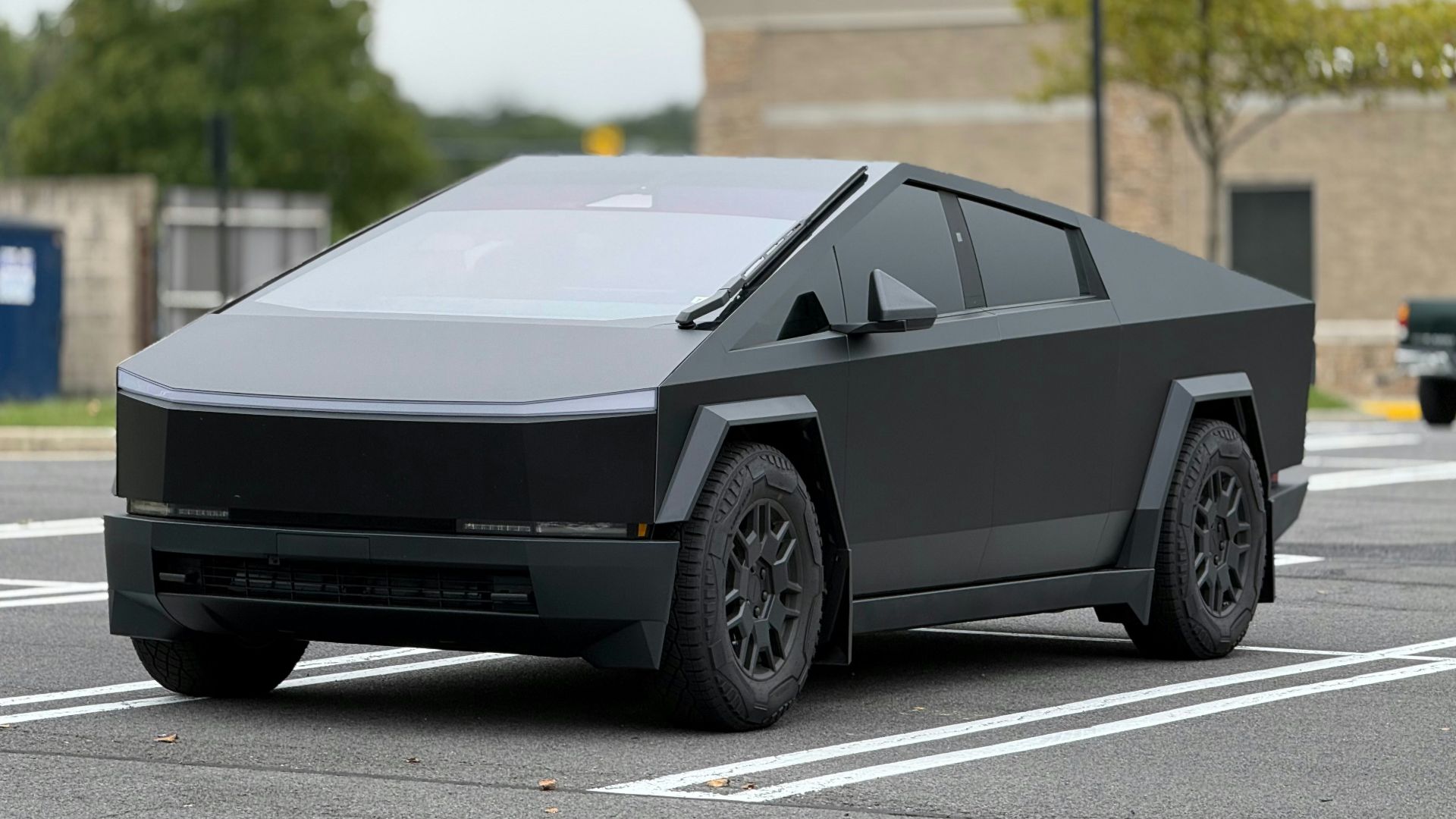 A futuristic car is parked in a parking lot
