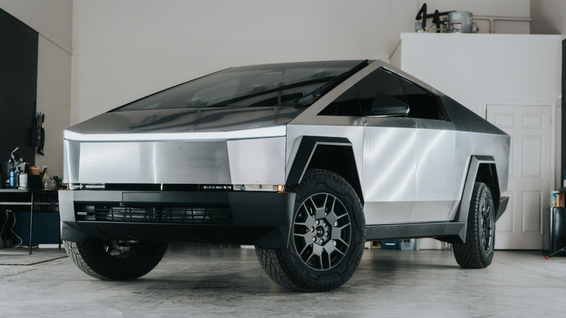 A futuristic car is parked in a garage
