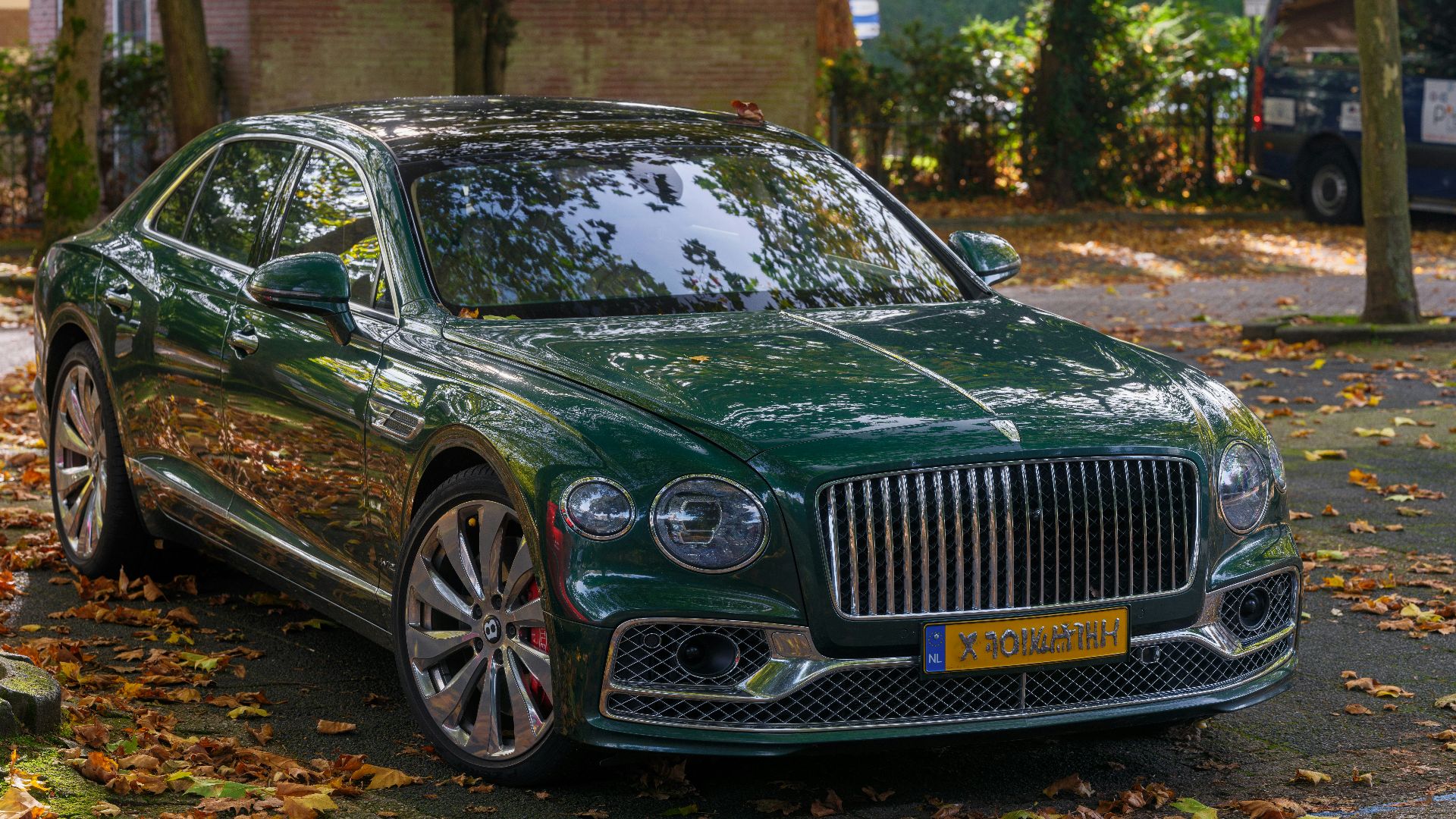 A green car parked on the side of the road