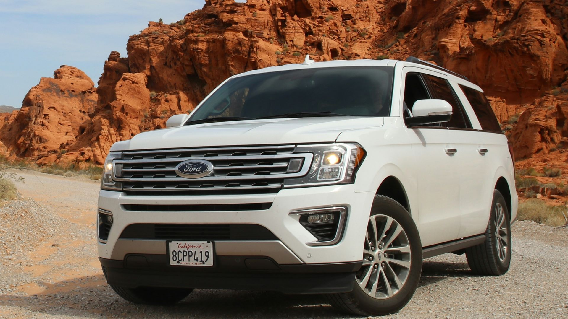 parked white Ford Explorer SUV