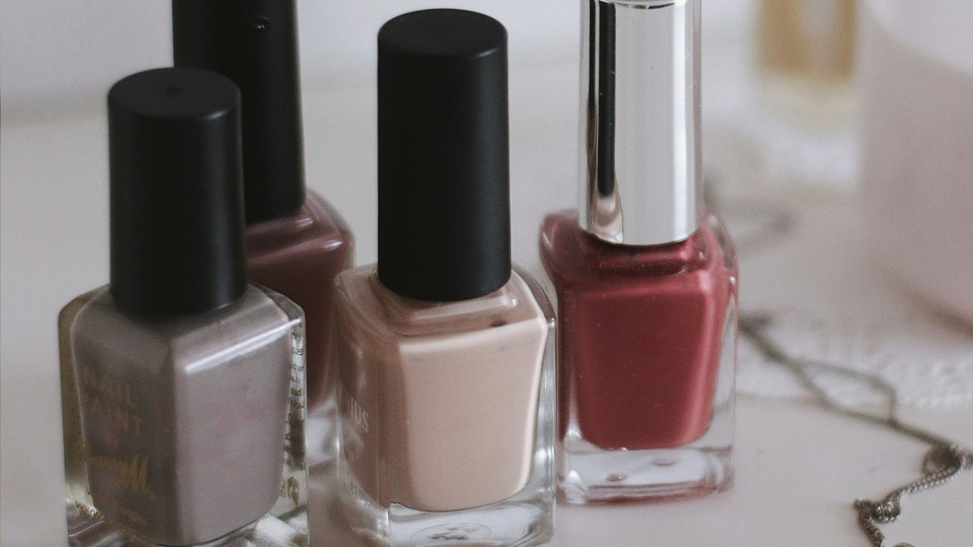 pink and black nail polish bottles