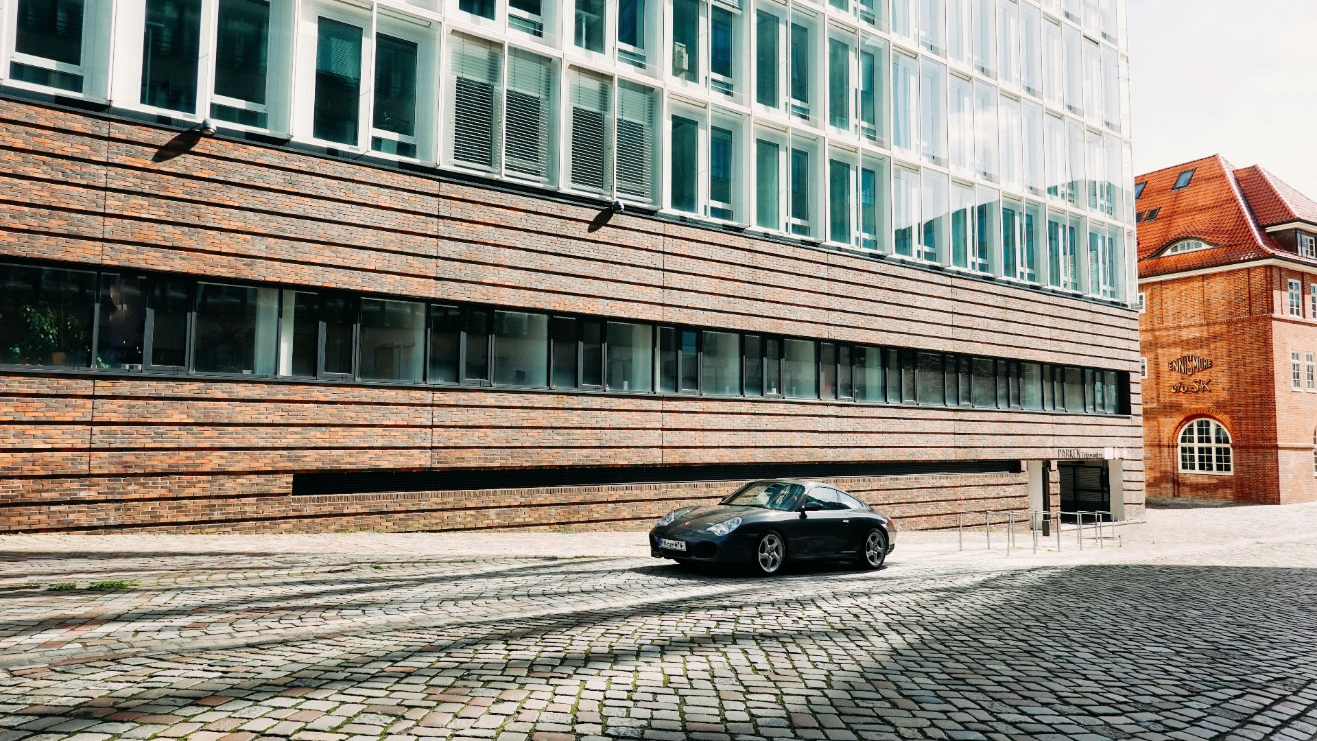 a car is parked in front of a building