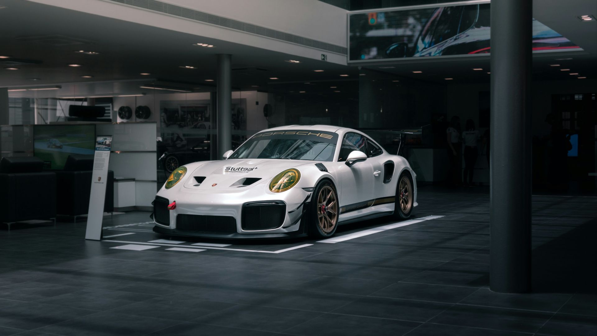 white bmw m 3 coupe parked in building