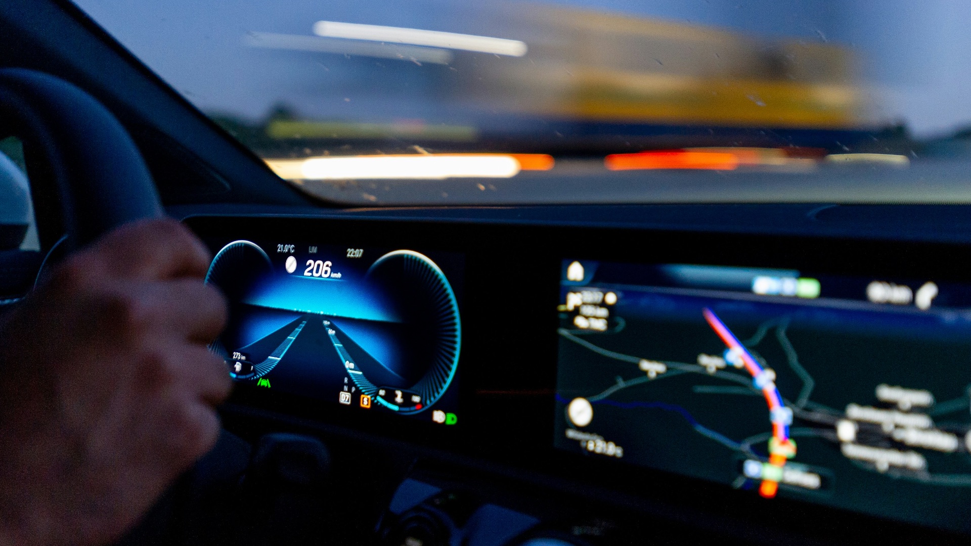 person's hand on steering wheel