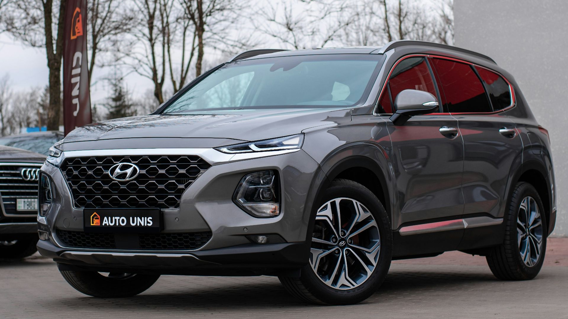 a black car parked next to a building
