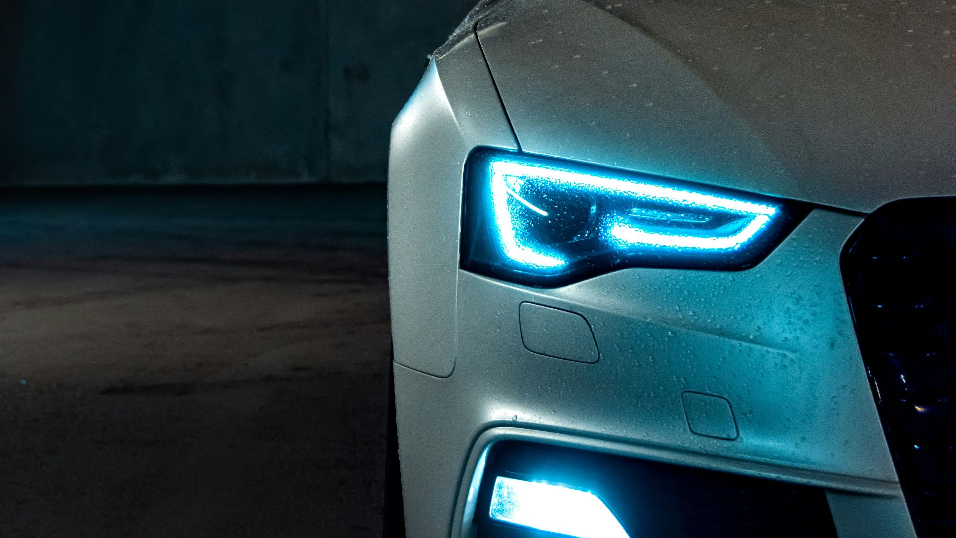 white vehicle with blue neon headlight bulb