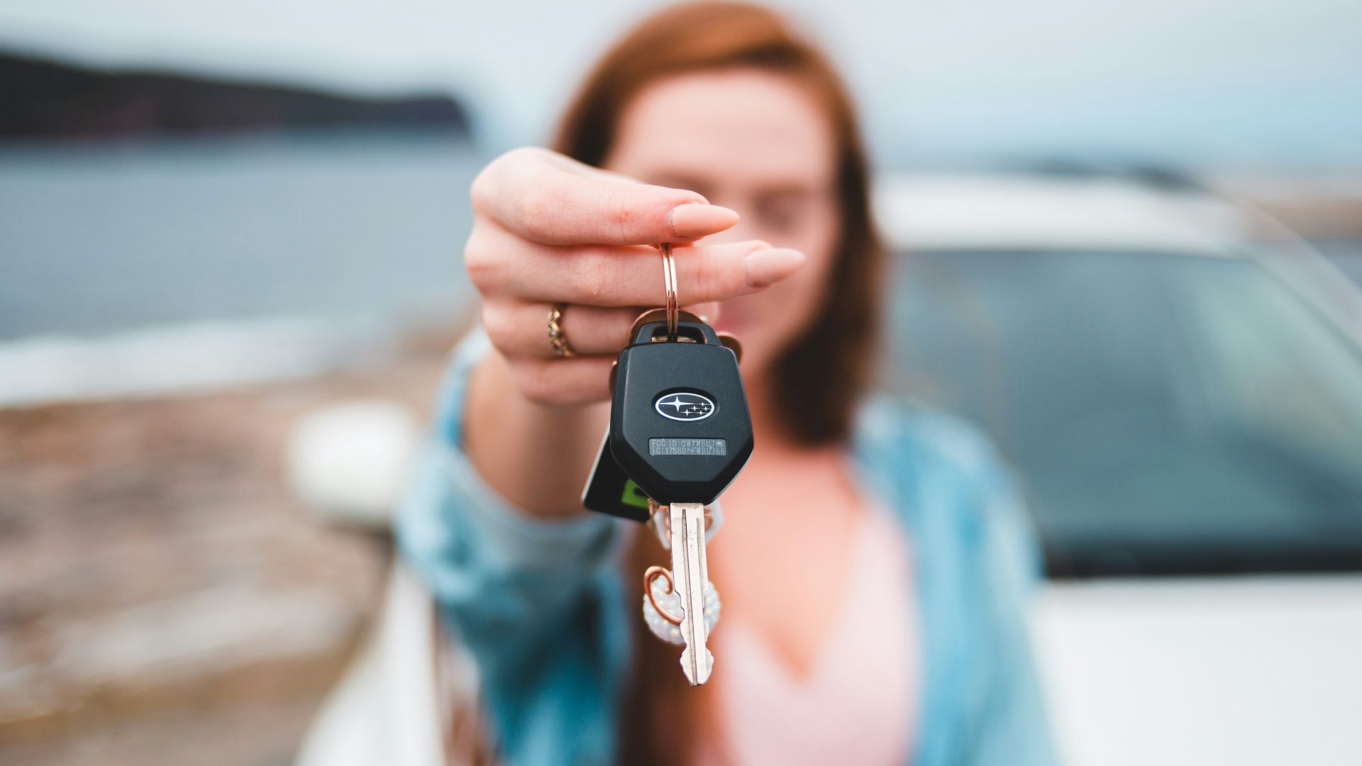 focus photography of black vehicle key