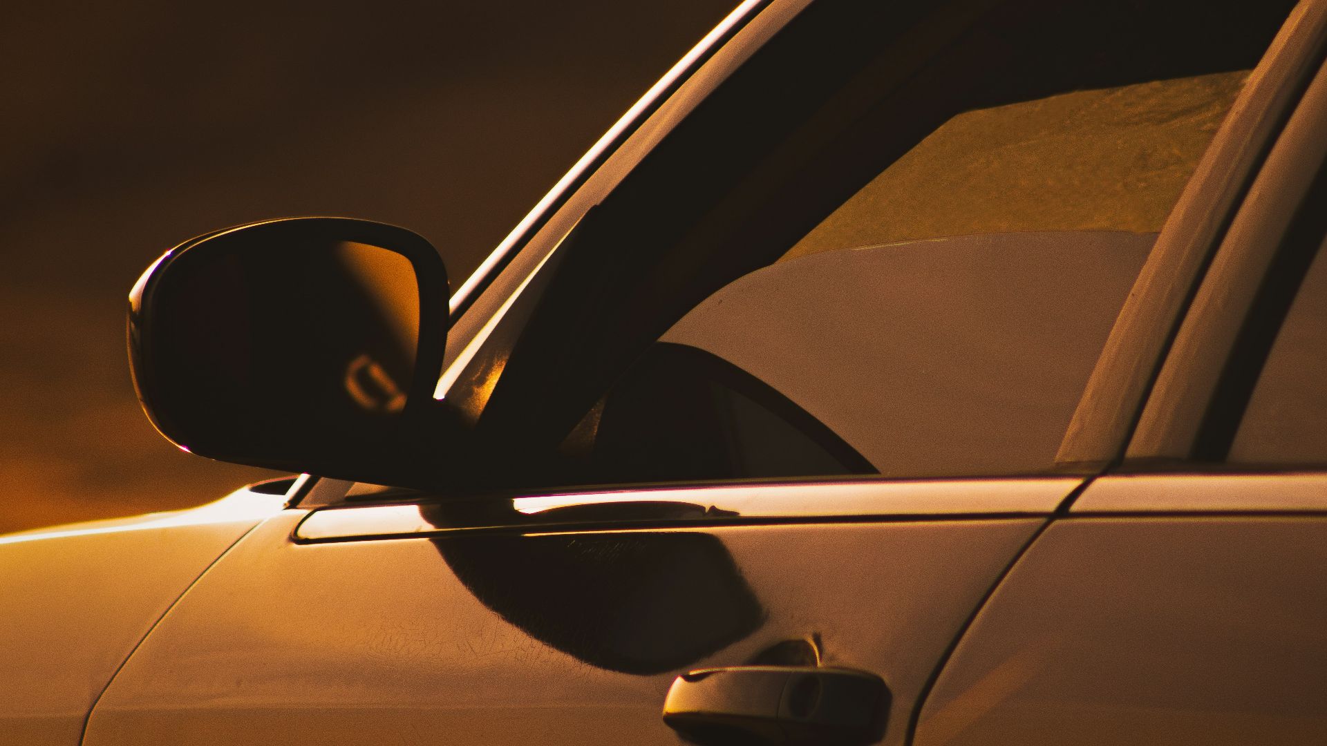 black car side mirror during night time