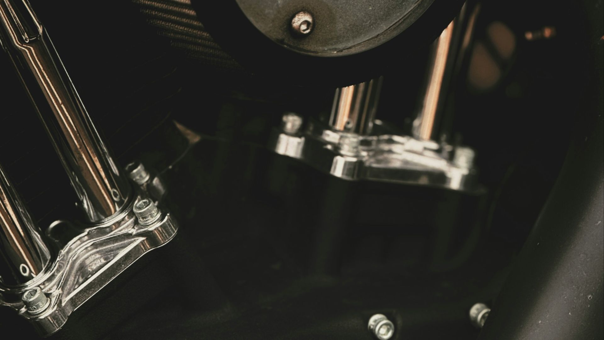 A close up of a black motorcycle engine