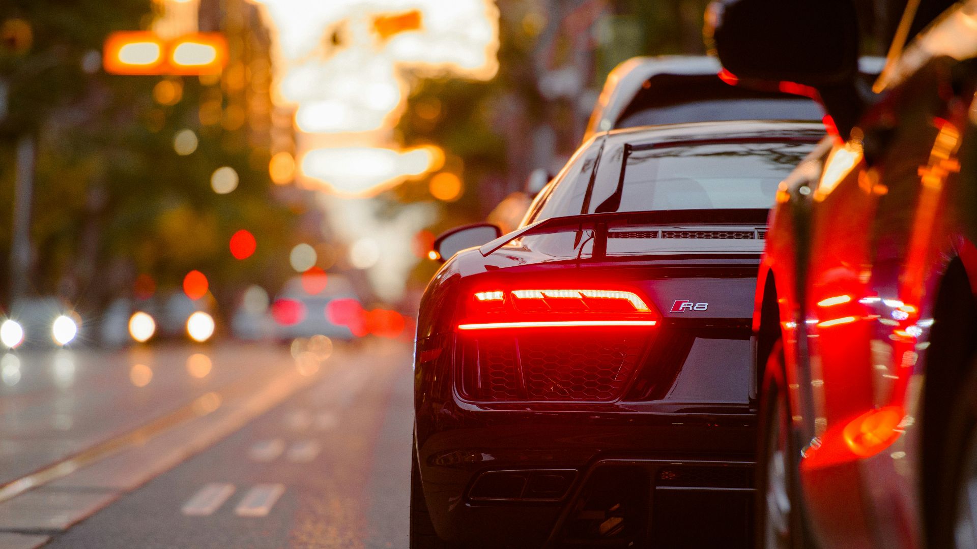 black Audi R8 parked beside road
