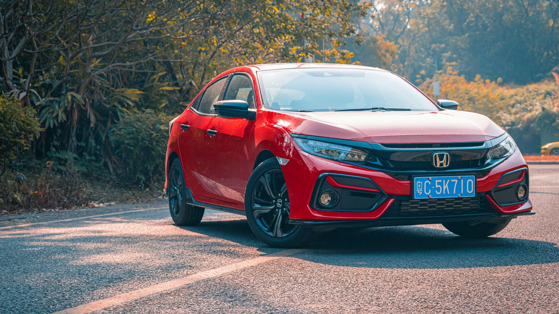 red audi r 8 on road during daytime