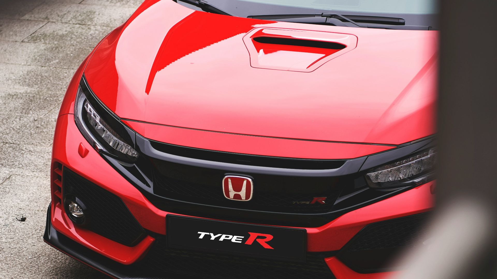 red Honda vehicle