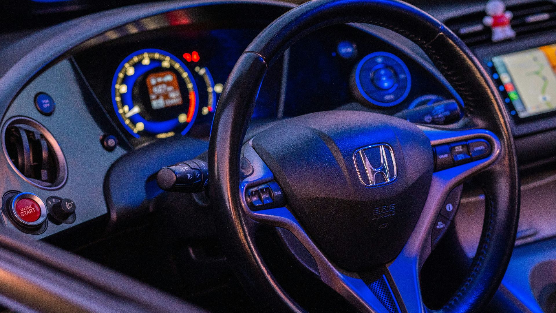 a steering wheel and dashboard of a car