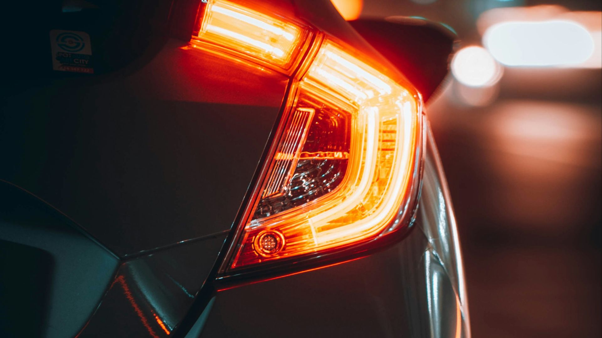 black car with red and yellow lights