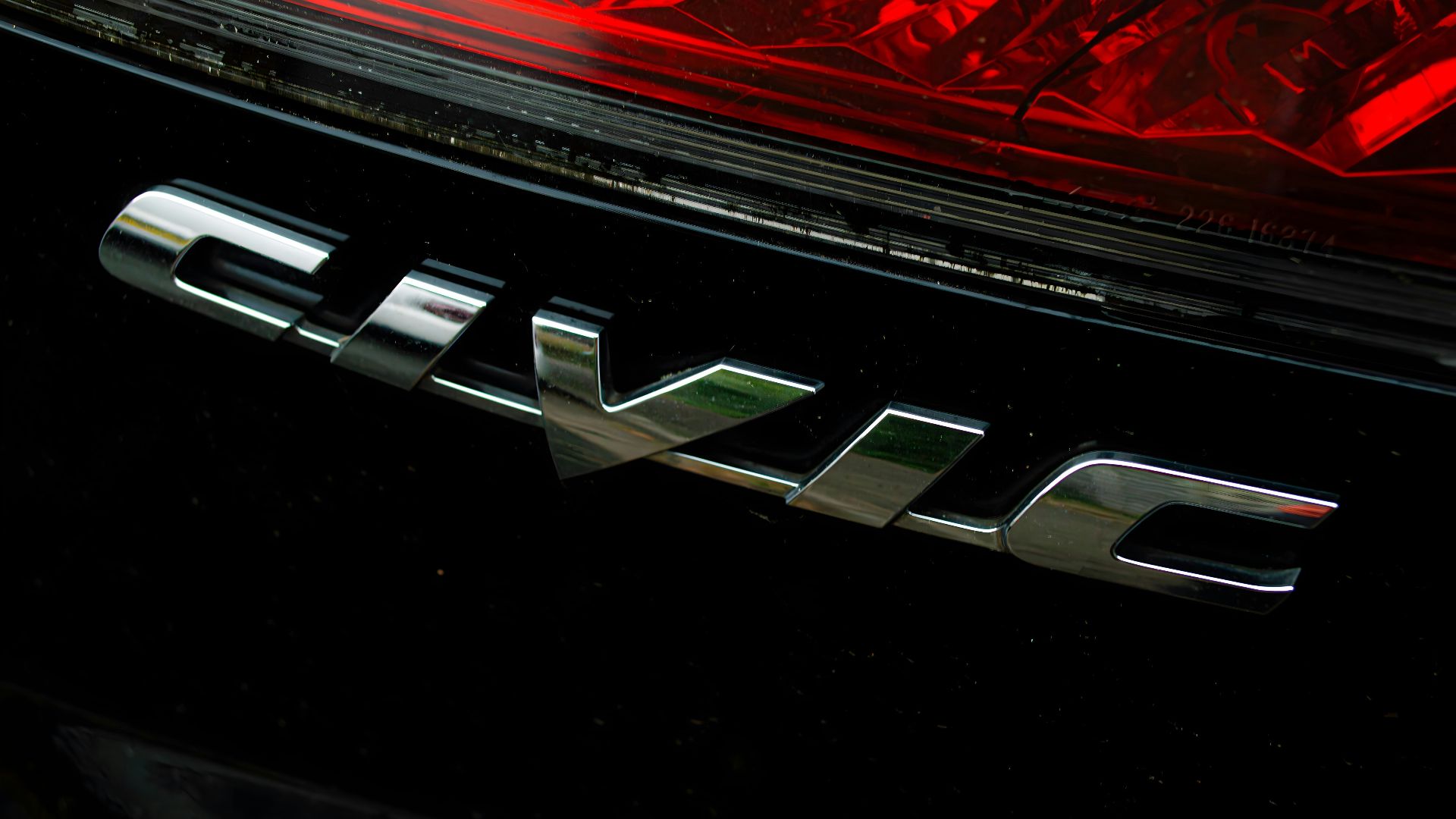 A close up of the tail light of a car