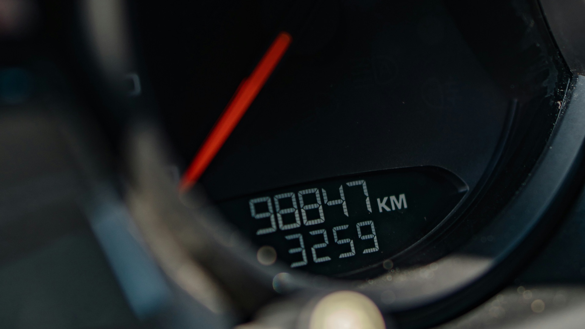 a close up of a speedometer on a motorcycle