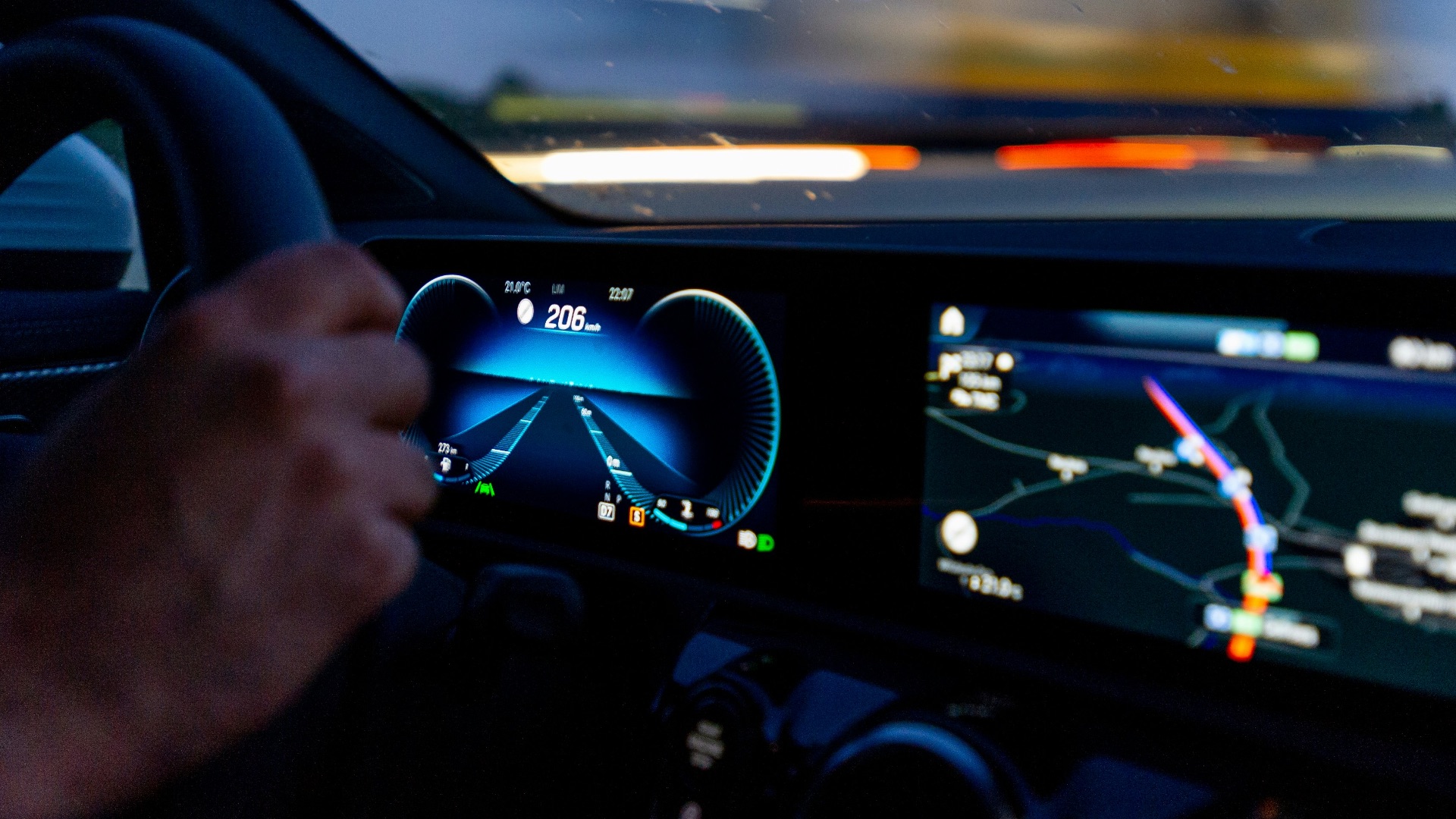 person's hand on steering wheel