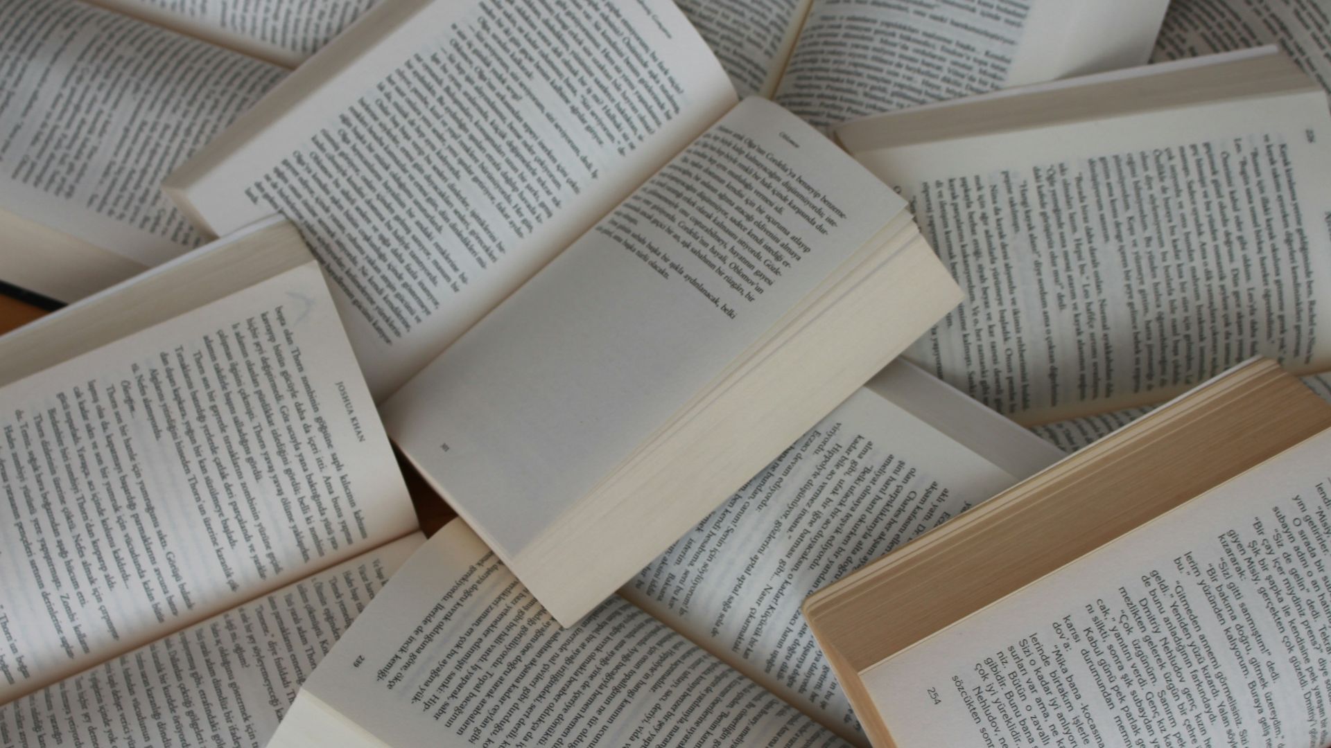 white and brown book on brown woven surface