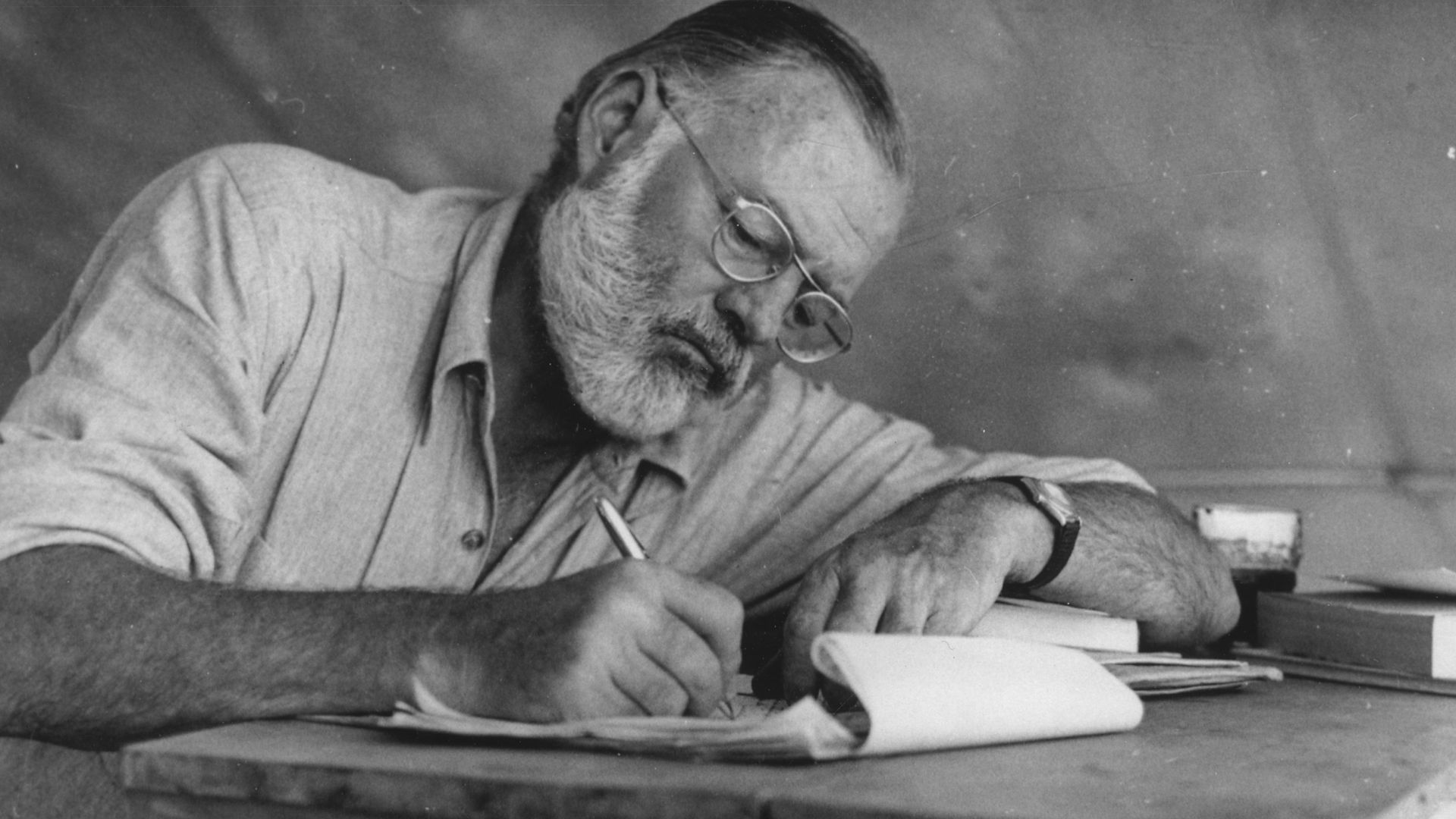 File:Ernest Hemingway Writing at Campsite in Kenya - NARA - 192655.jpg