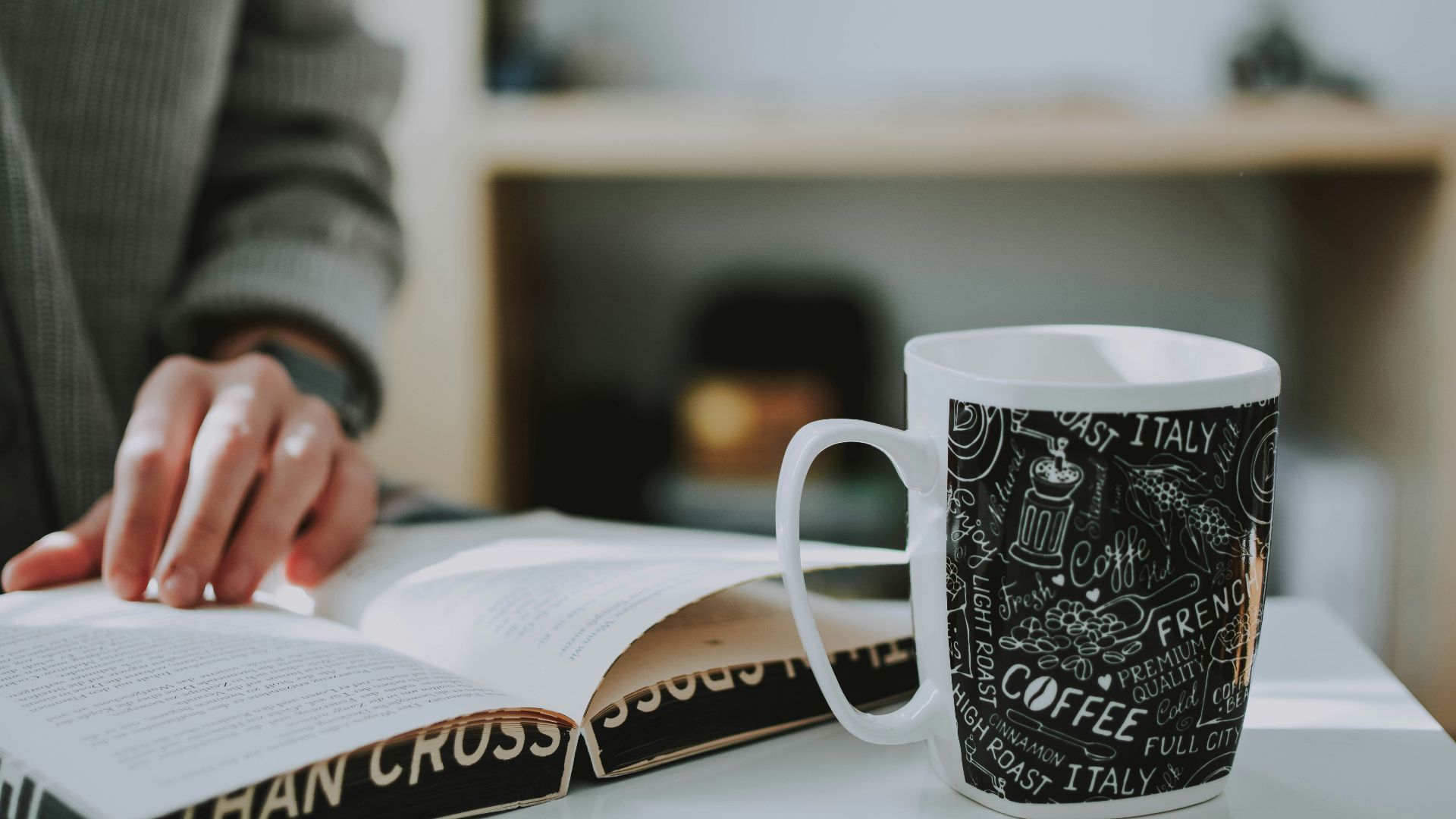 shallow focus photo of white and black ceramic mug