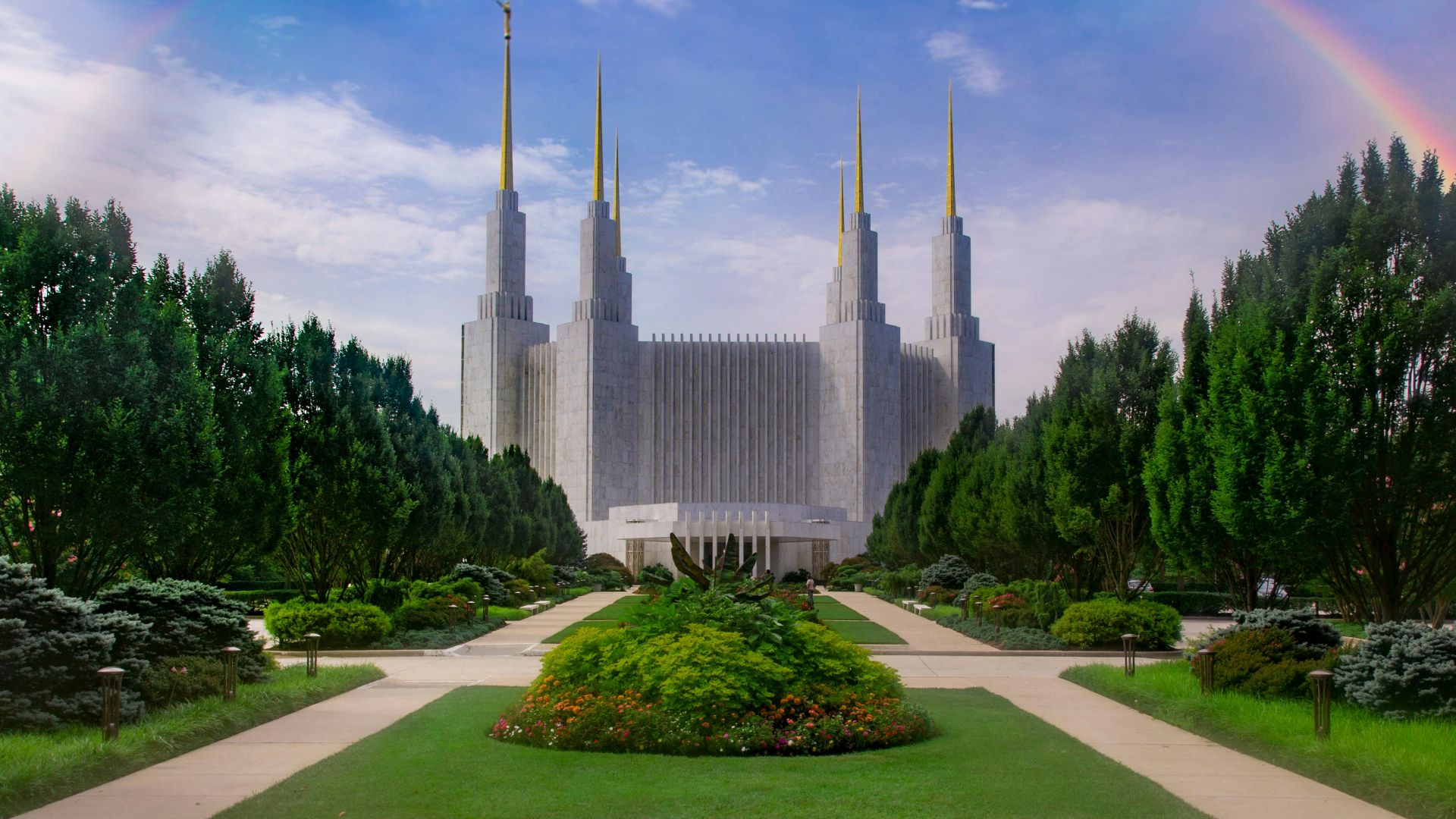 gray concrete building with rainbow illustration