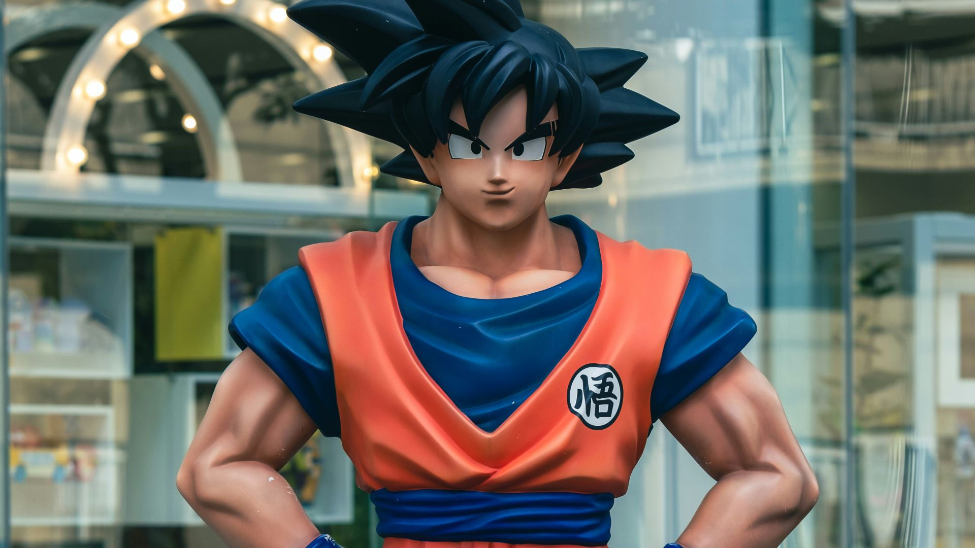 a statue of a man in a blue and orange outfit