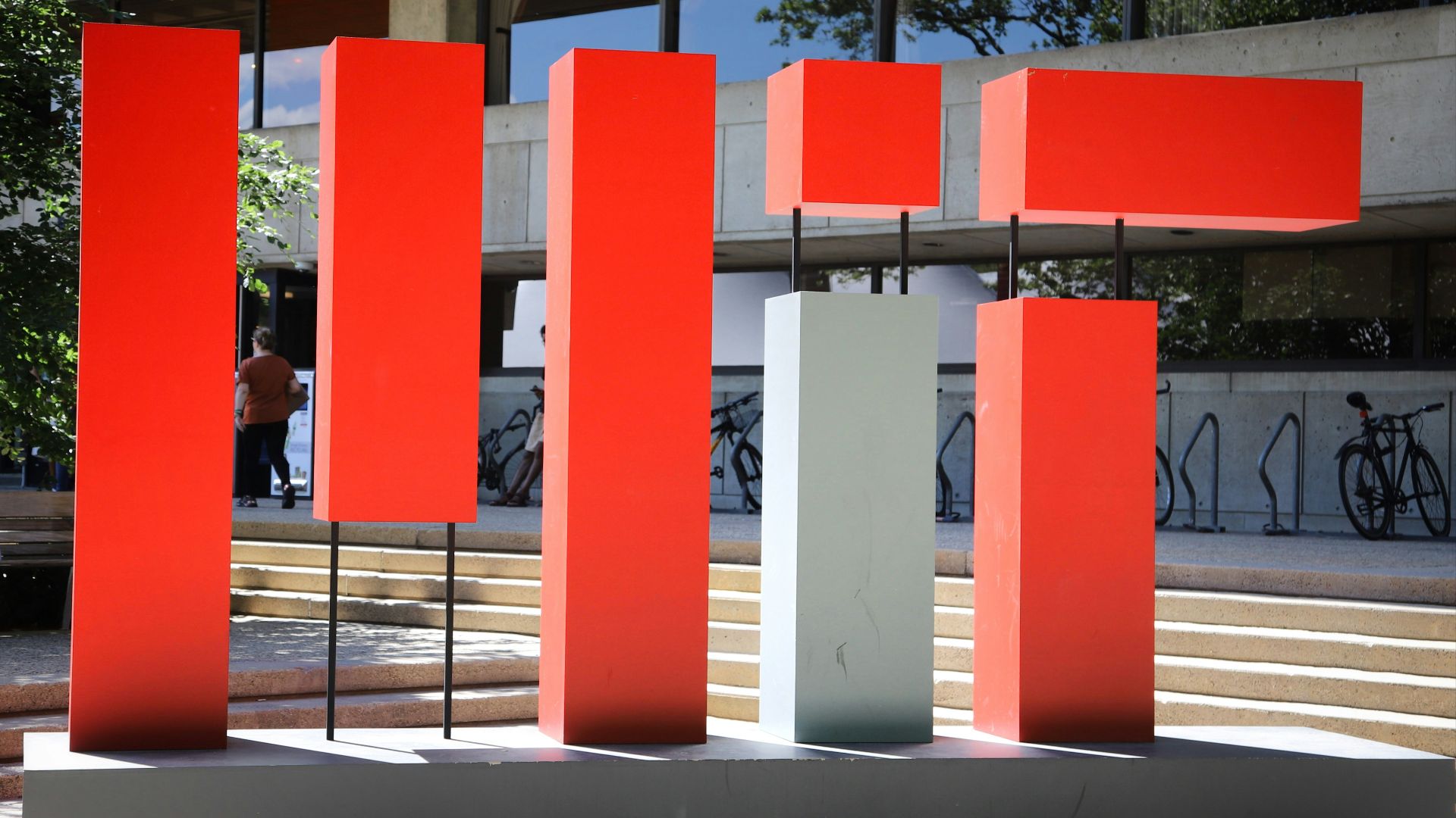 a person walking in front of a building
