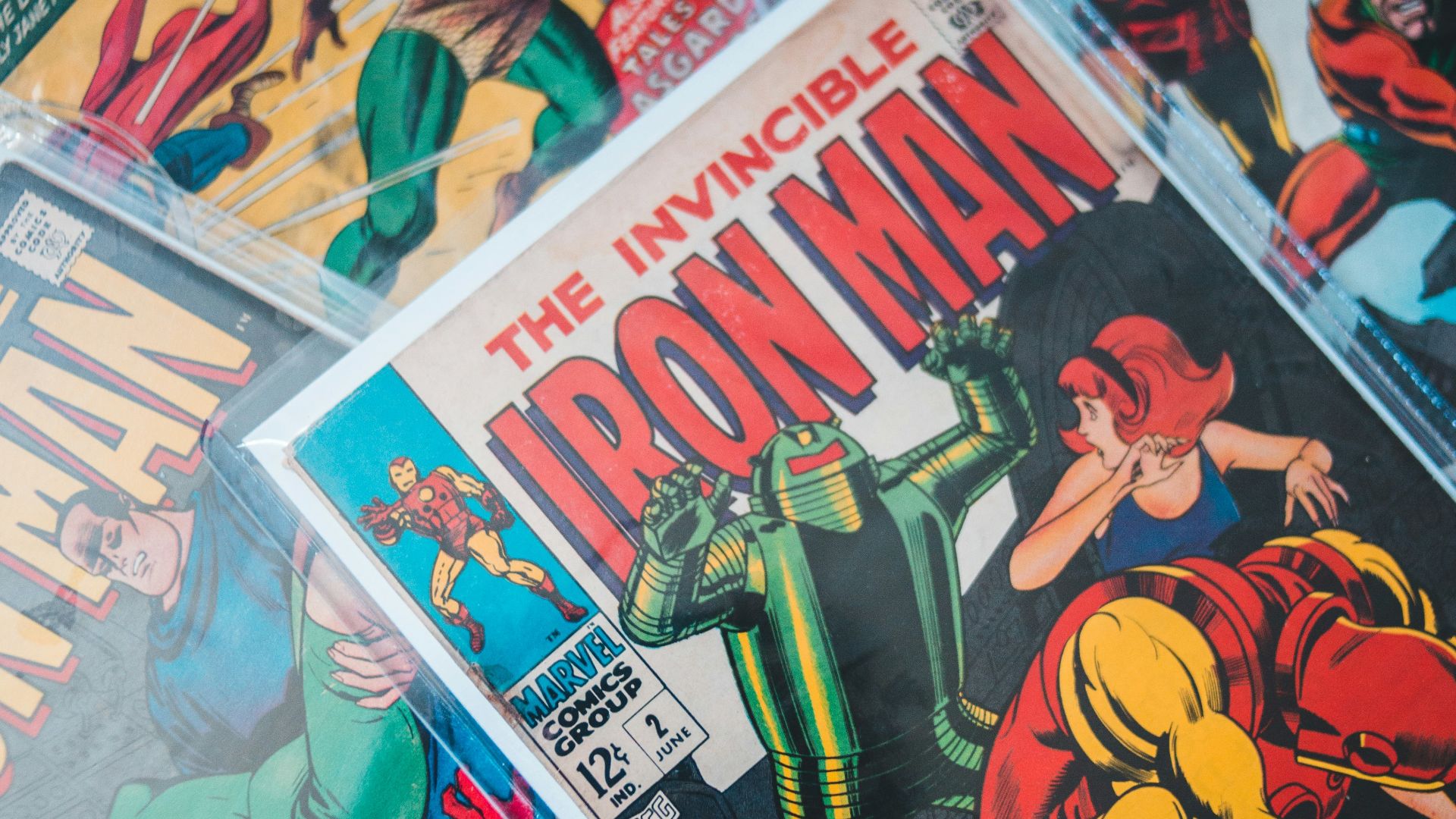 a pile of comics sitting on top of a table