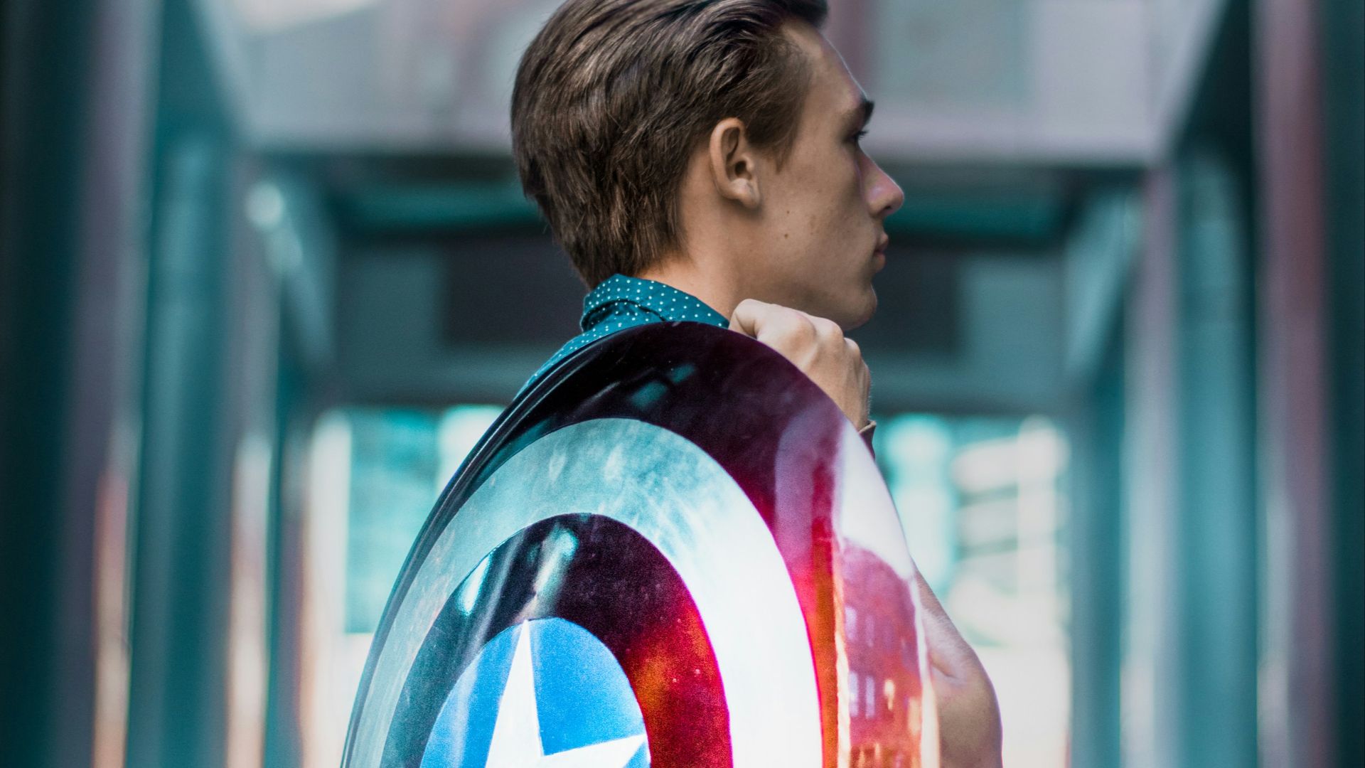 man carrying Captain America's shield