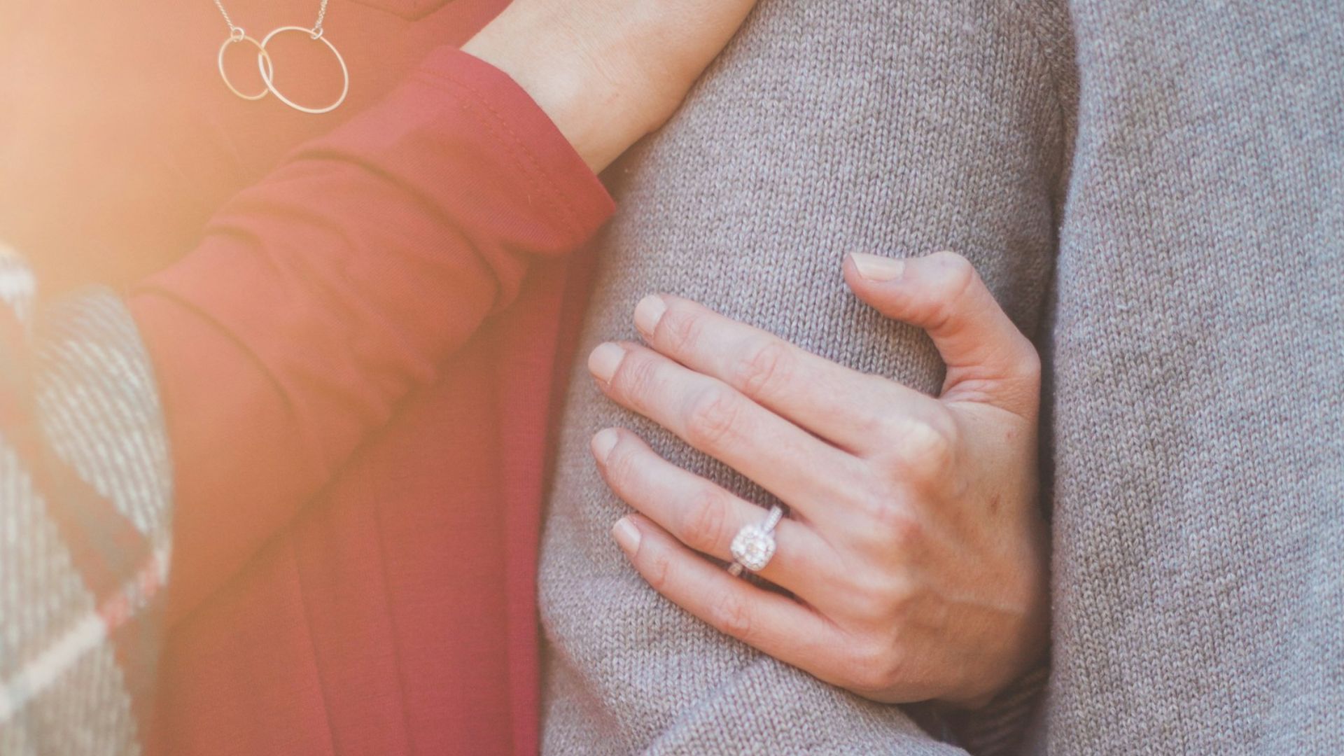 woman holding the shoulder of man