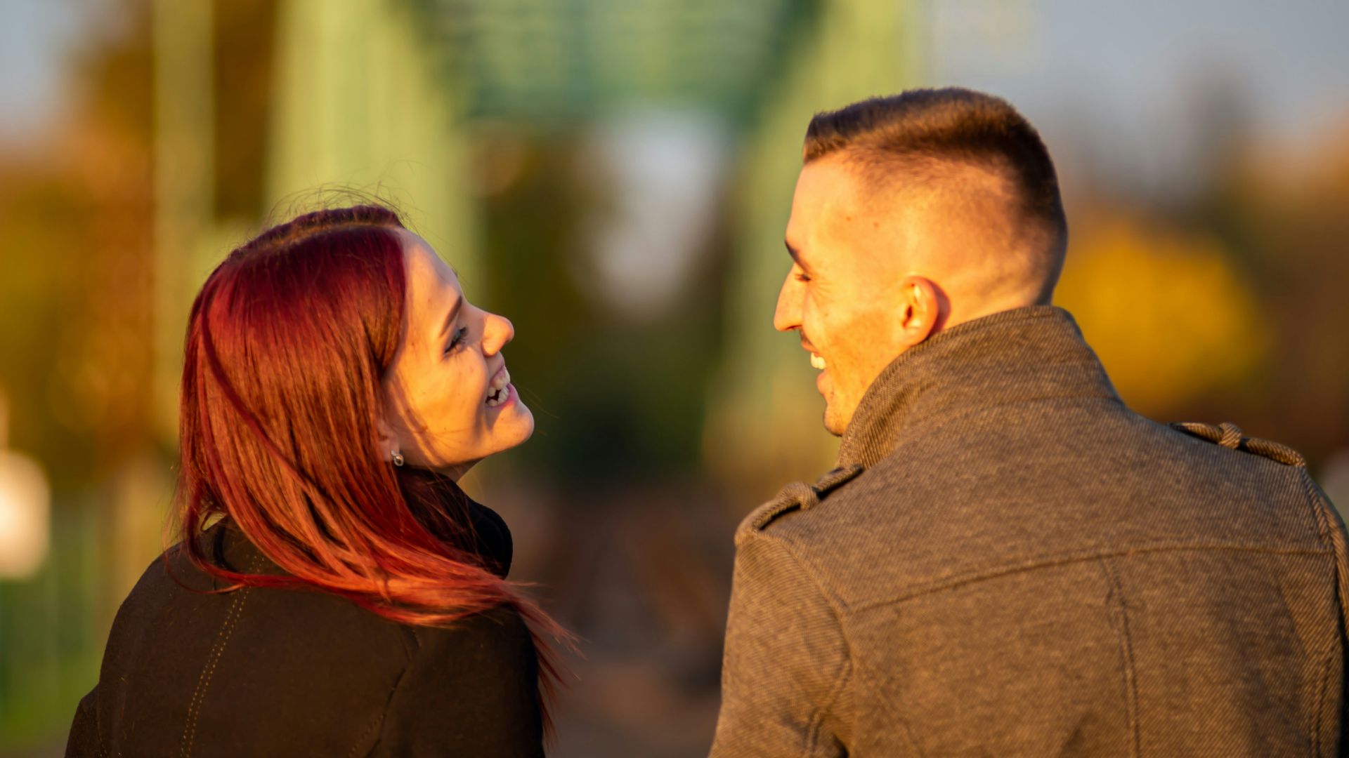 man and woman standing side by side during daytime