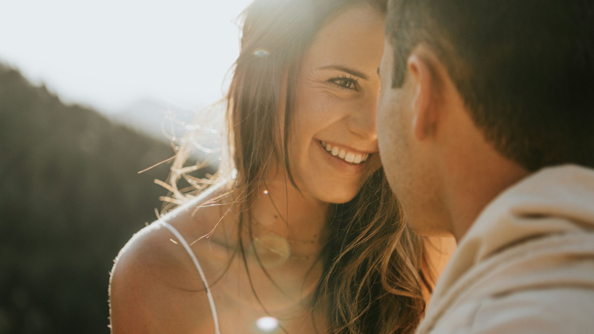 man and woman kissing during daytime