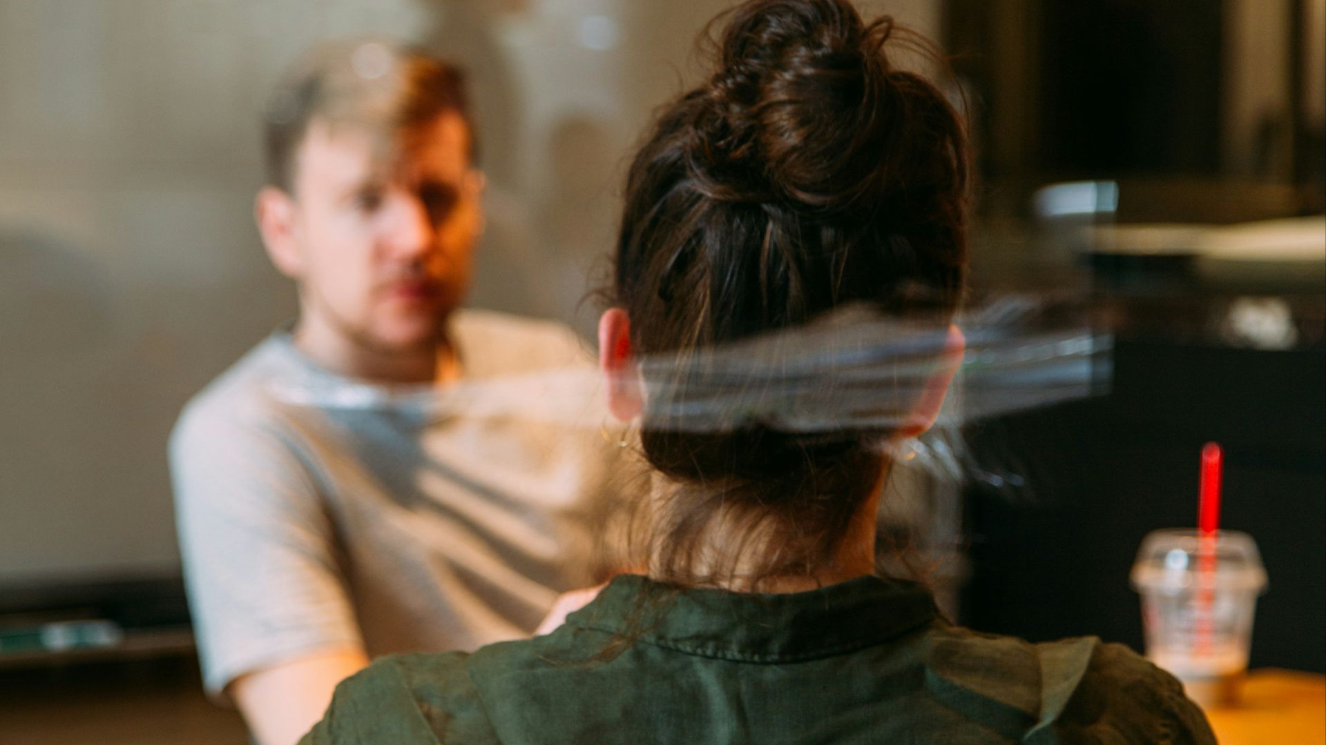person sitting in a chair in front of a man