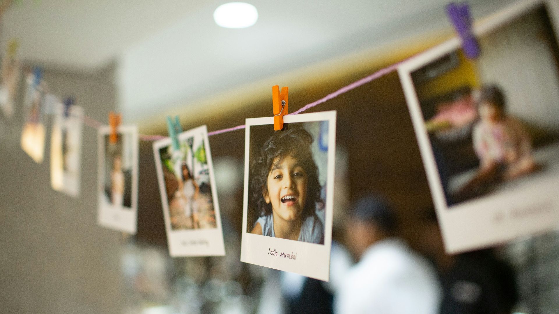 woman in white long sleeve shirt holding white printer paper