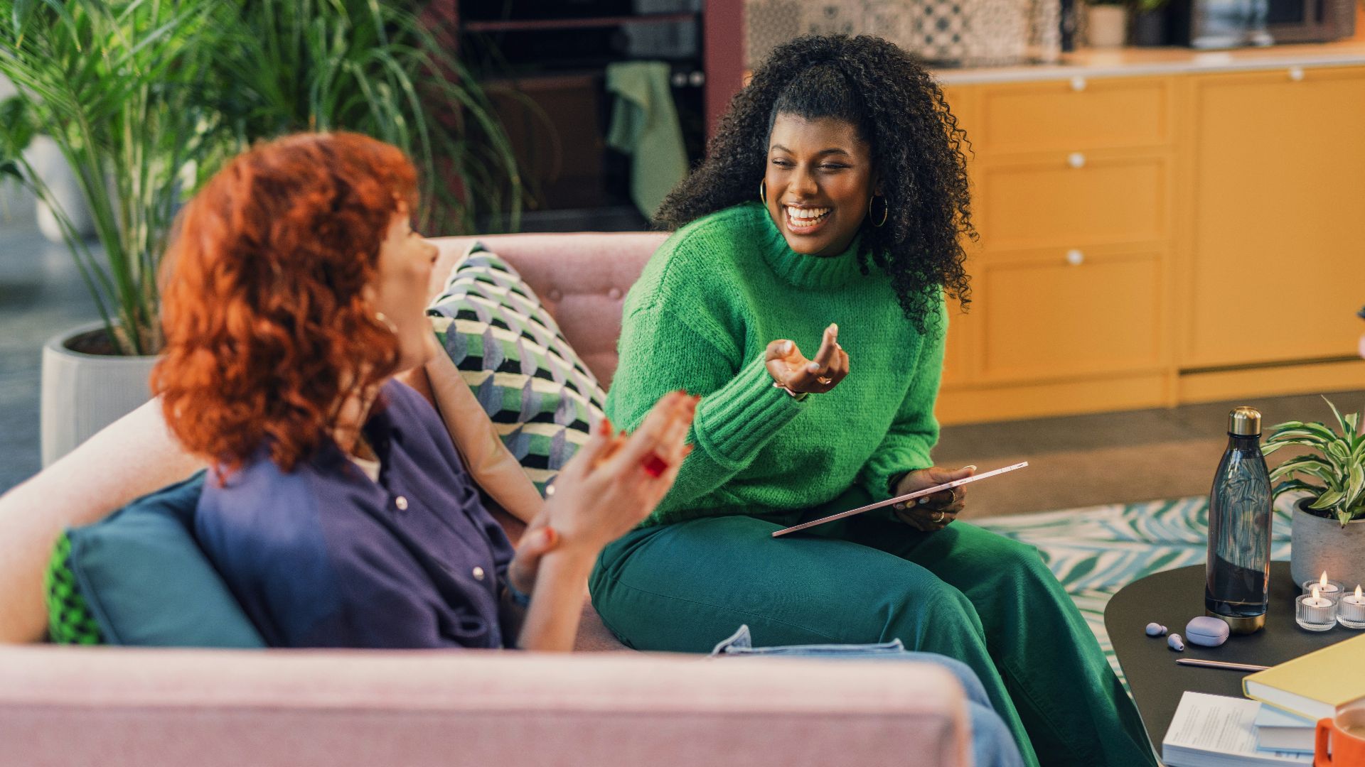 a woman and a man sitting on a couch