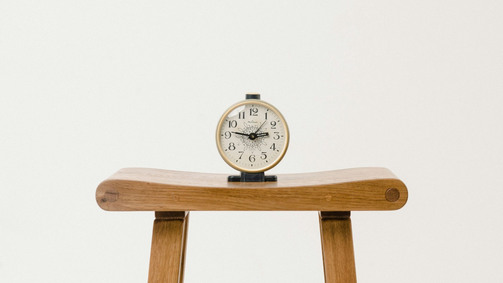 brown wooden table clock at 10 10