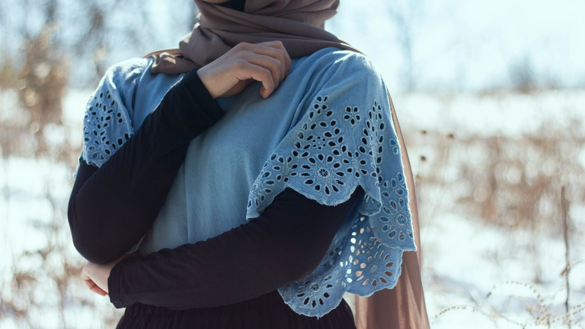 woman in blue hijab and white long sleeve shirt
