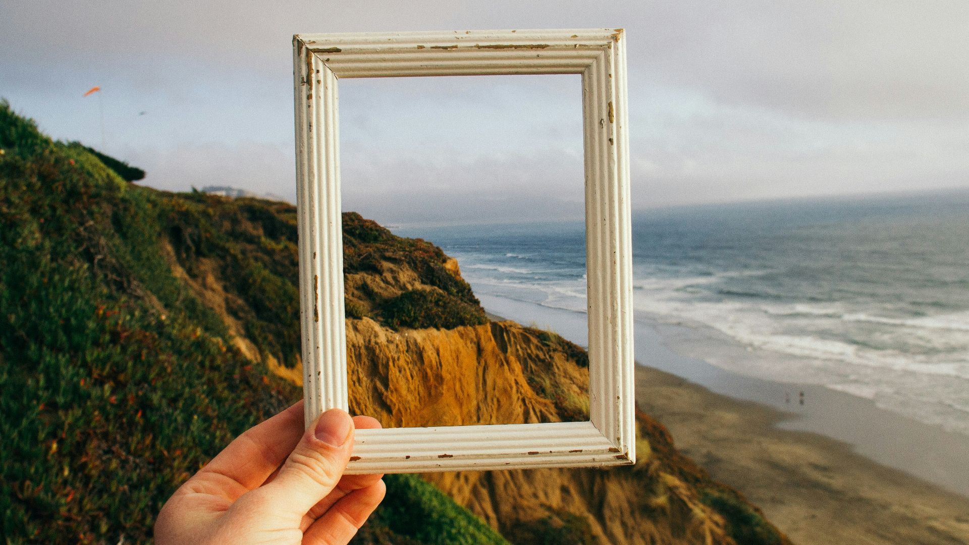 person hand holding photo frame