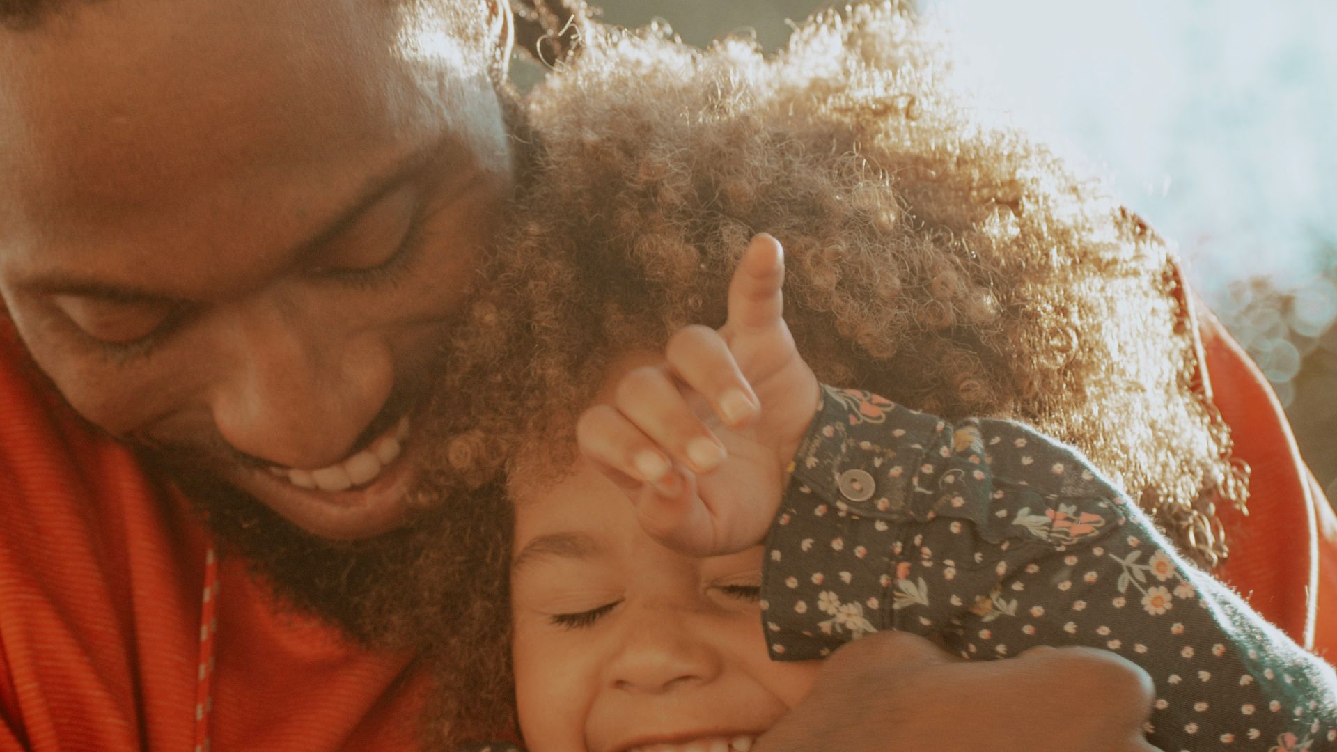 woman in red hoodie holding her hair