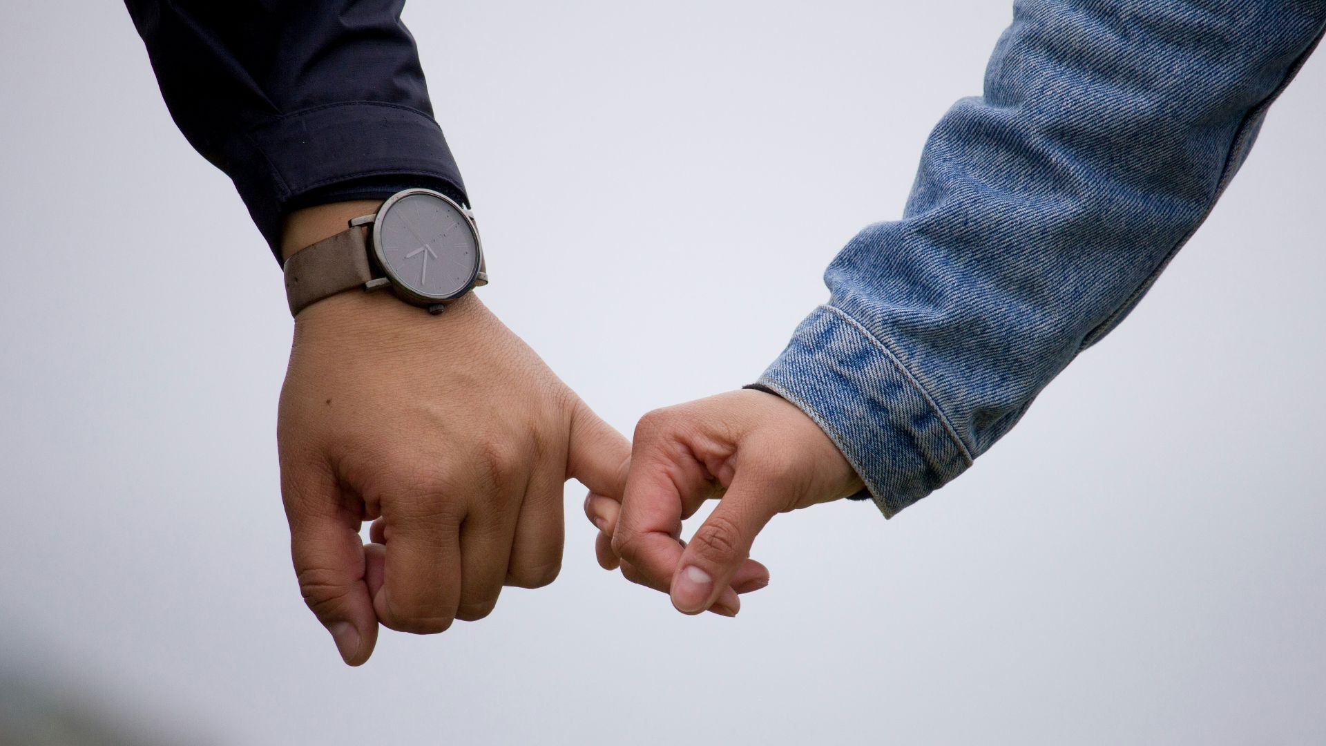 man and woman holding hands together