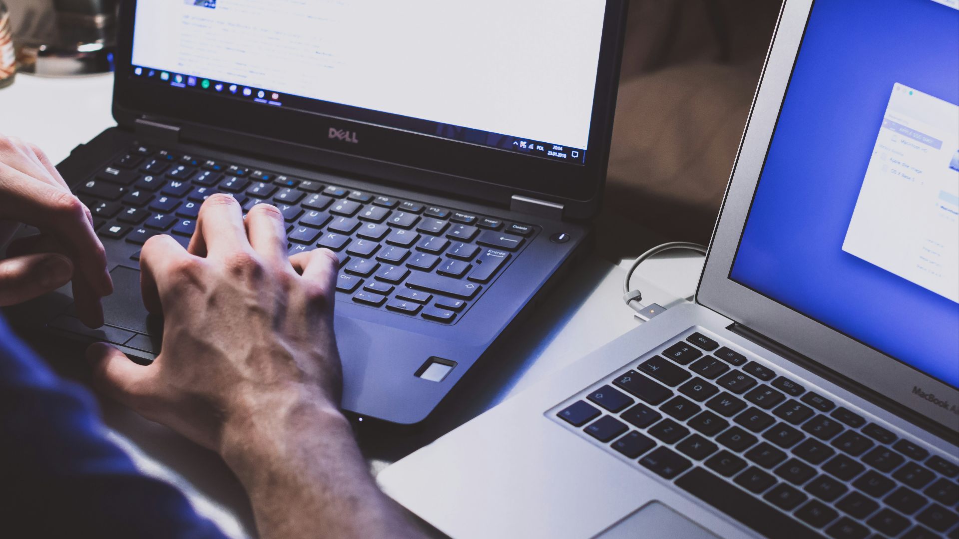 person using black laptop computer