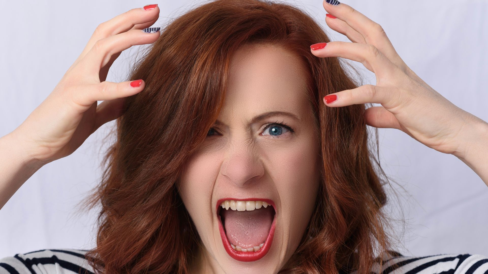 smiling girl in black and white striped shirt