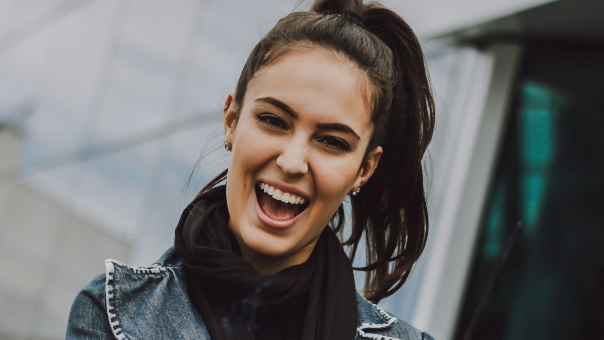 woman wearing gray denim jacket and black scarf