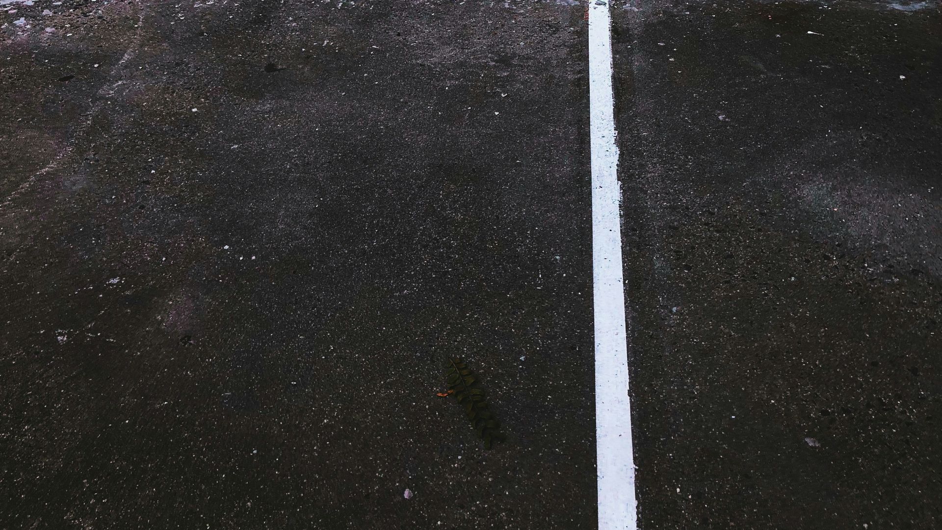 a parking meter on the side of a building