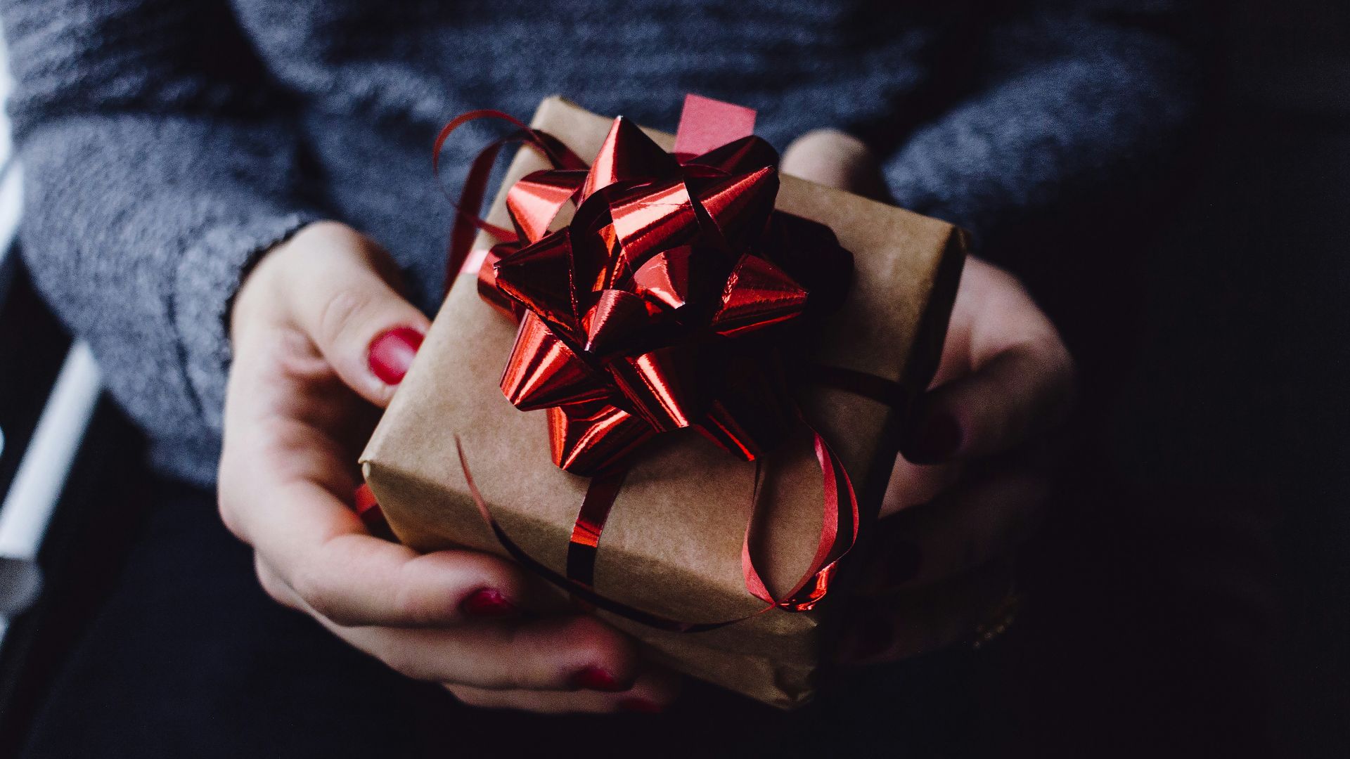 person holding present box