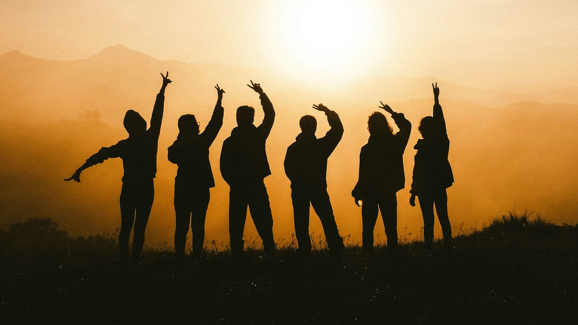 silhouette photo of six persons on top of mountain