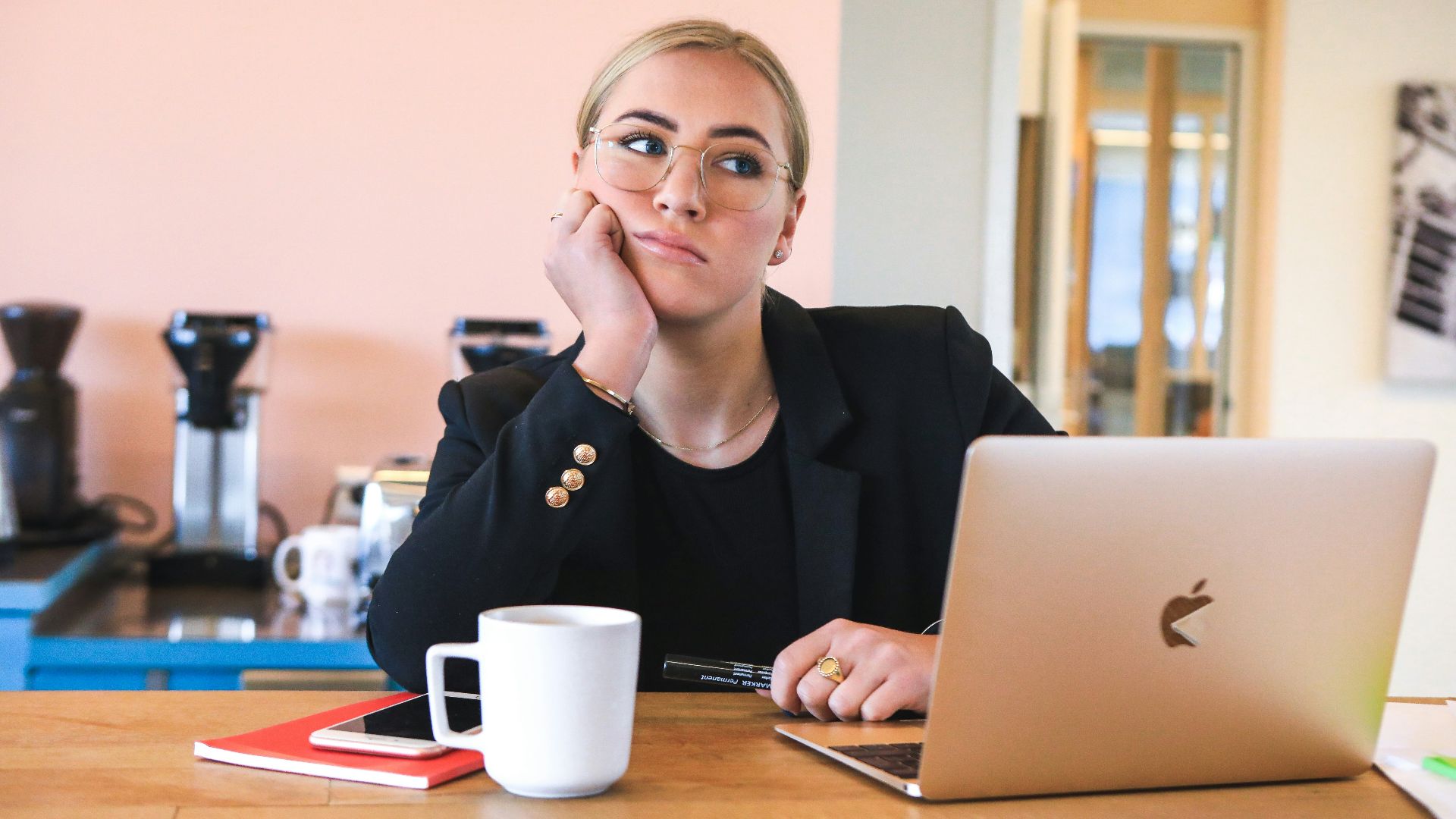 woman in black long sleeve shirt using macbook